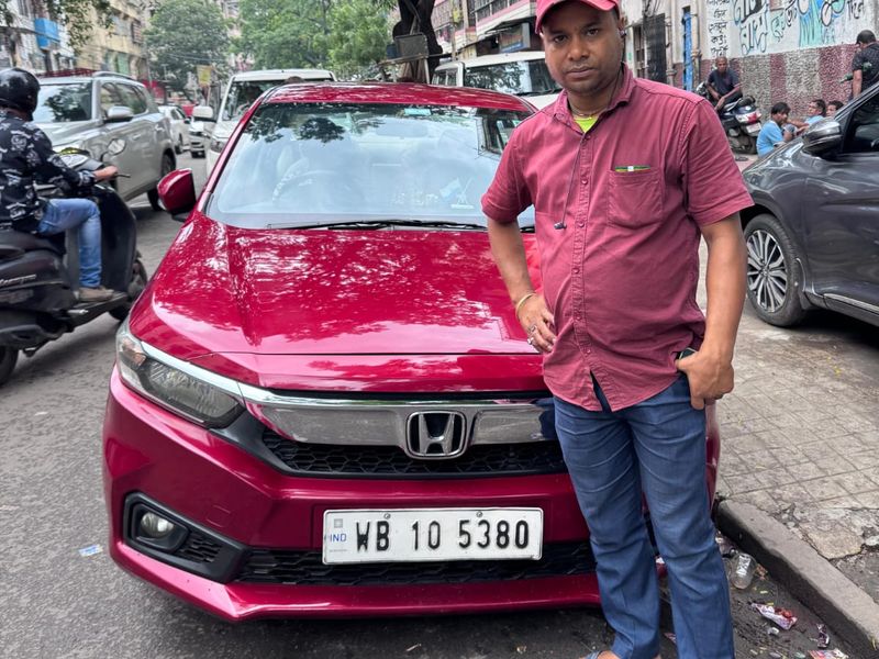 Red Honda Amaze with Bhagirath Das
